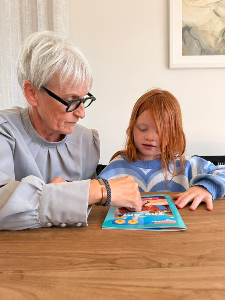Ali Fullick teaching a child to read using Innerlinks decodable books during a UFLI-aligned phonics session