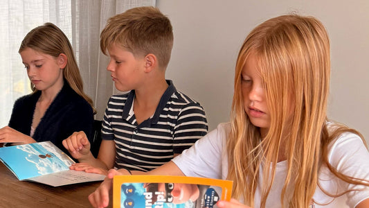 three older kids reading